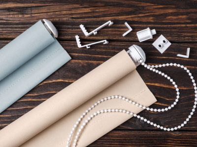 The,Rolled,Beige,Shutters,Is,On,A,Wooden,Surface.,Beige