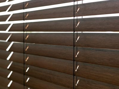 Close-up,Of,Half-closed,Wood,Blinds,Showcasing,Their,Sleek,Design,And